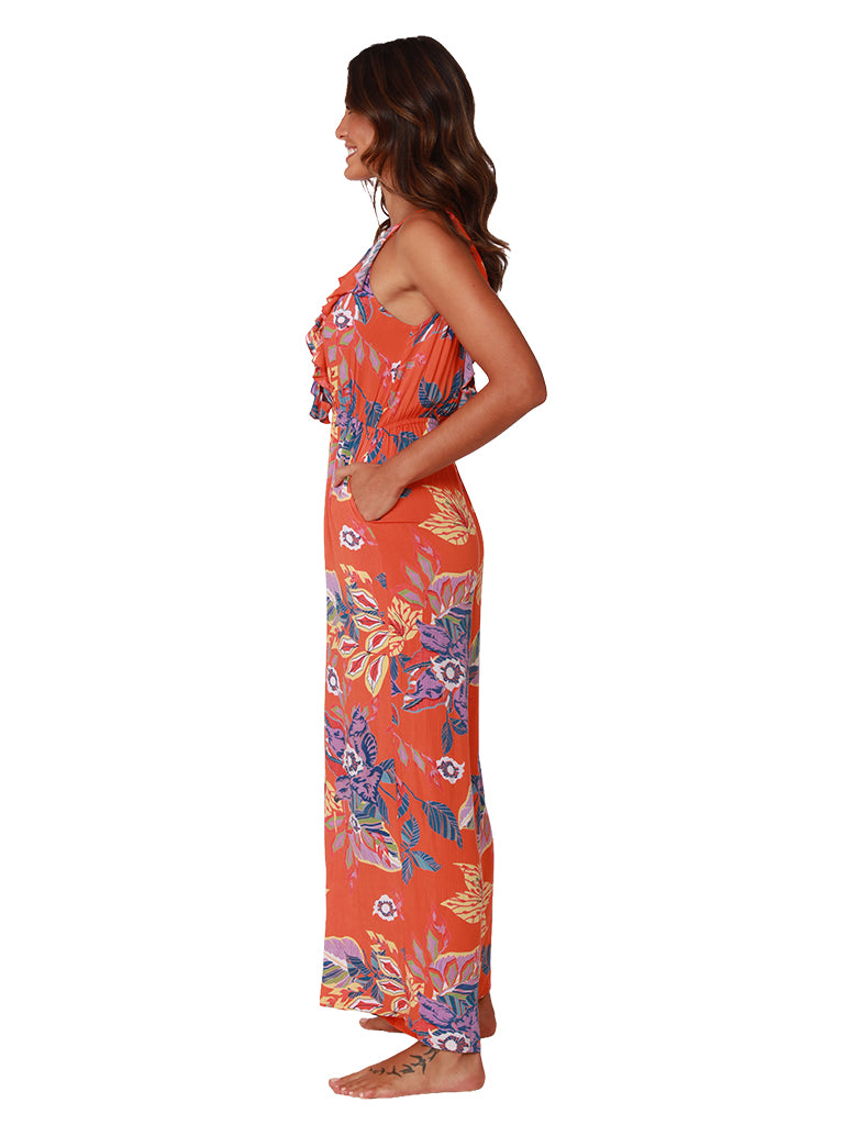 Floral print jumpsuit features a front ruffle, side view
