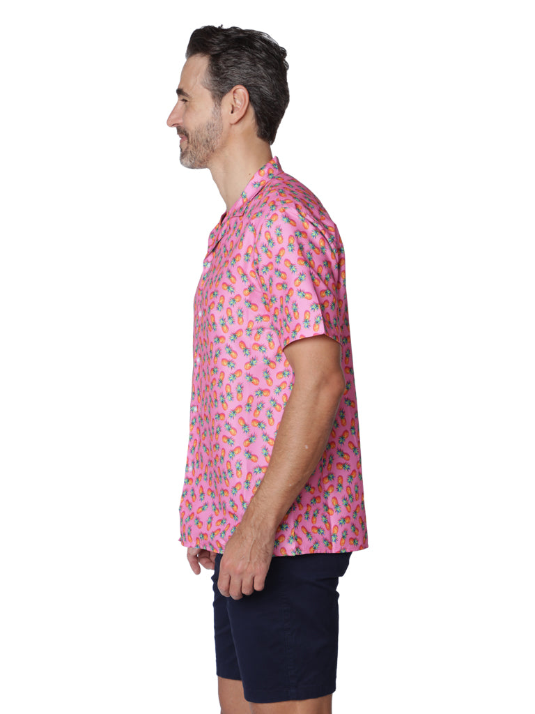 Men's Hawaiian shirt in "pink pineapple" print.