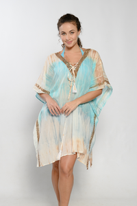 Tasseled poncho with metal detailing along the collar, arm openings and sides in Turquoise and gold tie dye