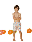 Boy's board shorts patterned in surfboards, front view