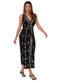 Sleeveless wrap dress in black in a knot and tassel print, front view